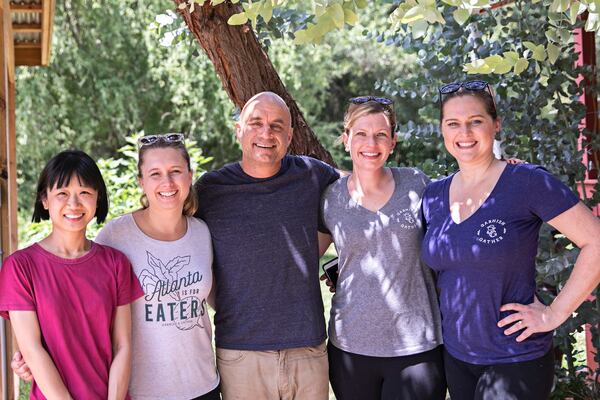  The Garnish & Gather team gets to know their farmers through visits. Here Emily Golub (second from right) and her team meet with Nicolas Donck (center) of Crystal Organic Farm in Newborn. The farm has been supplying produce for Garnish & Gather since the beginning. (Photo credit: Heidi Geldhauser)