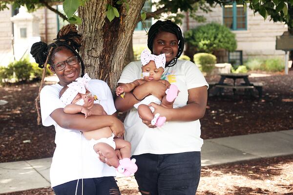 Now that the family is together, 13-year-old Mariah (left) has claimed Averie as her baby, and 12-year-old
Maddison says Ava is hers.
Photo by David Mahone, courtesy of the Jones family.