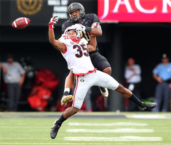 October 7, 2017 Nashville: Georgia cornerback Aaron Davis breaks up a pass to Vanderbilt tight end Jared Pinkney during the first half in a NCAA college football game on Saturday, October 7, 2017, in Nashville.   Curtis Compton/ccompton@ajc.com