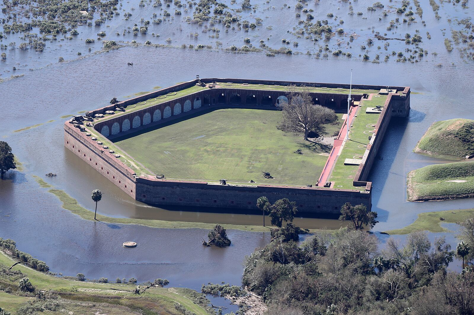 Historic Fort Pulaski National Monument is completely surrounded by flood waters in the aftermath of Hurricane Matthew on Sunday, Oct. 9, 2016, in Savannah. Curtis Compton /ccompton@ajc.com