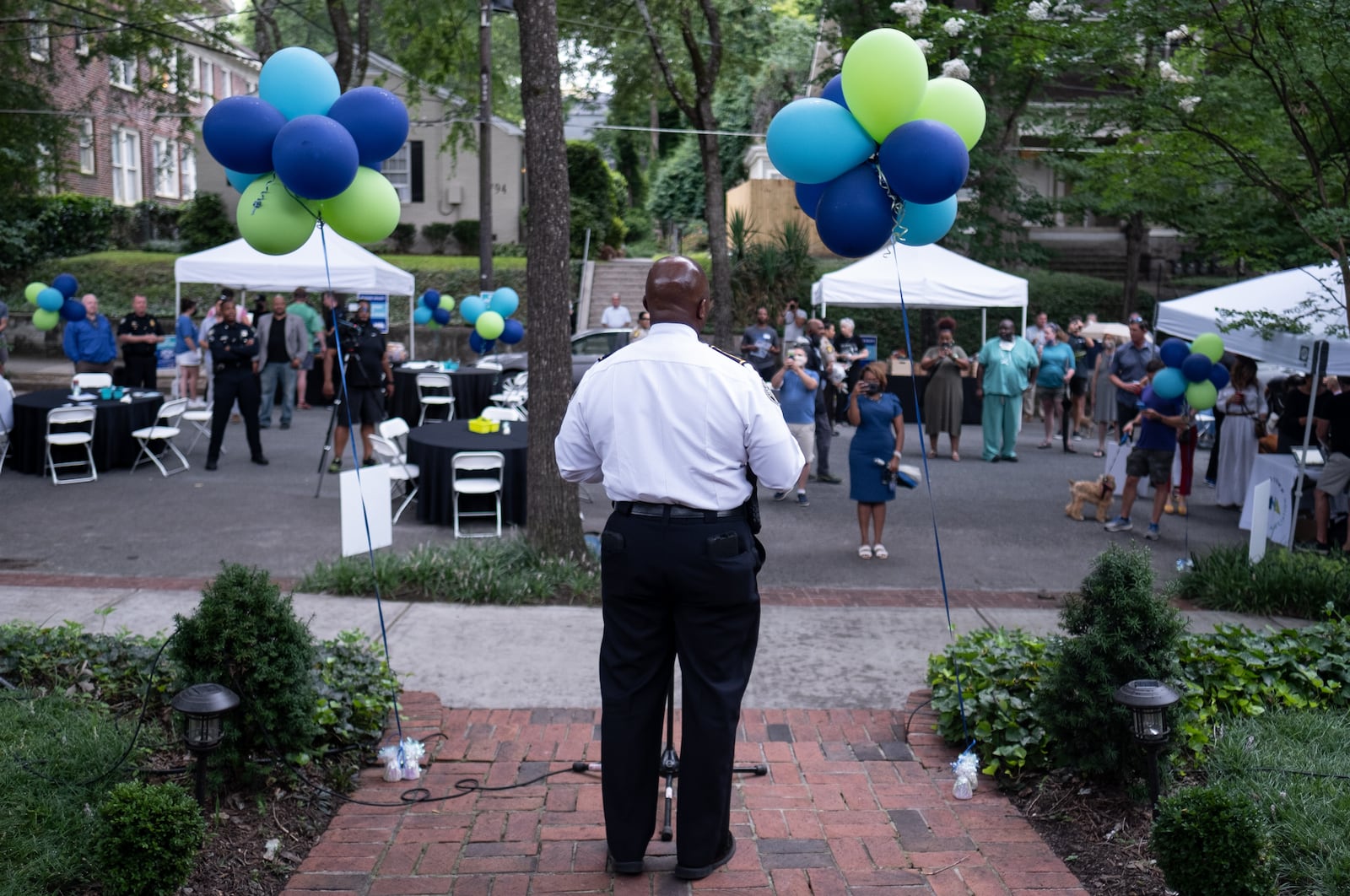 Atlanta Police Chief Rodney Bryant talks with residents in Midtown Atlanta on Tuesday during a National Night Out event hosted by the Midtown Neighbors’ Association.