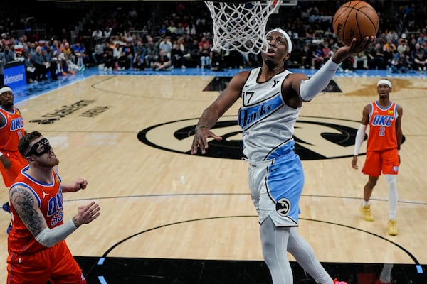 Atlanta Hawks forward Onyeka Okongwu (17) shoots against Oklahoma City Thunder center Isaiah Hartenstein (55) during the first half of an NBA basketball game, Friday, Feb. 28, 2025, in Atlanta. (AP Photo/Mike Stewart)