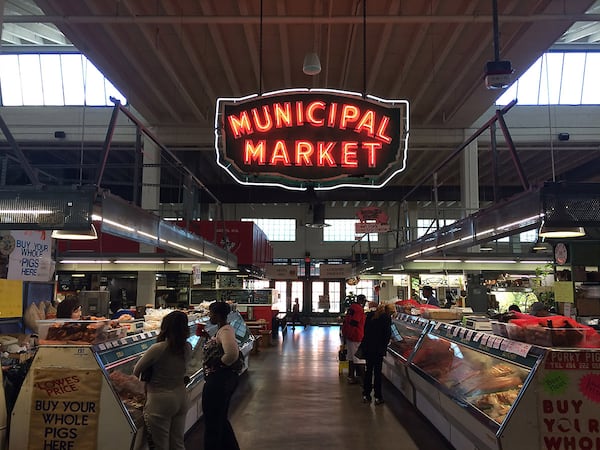 The Sweet Auburn Curb Market: Why is that main sign inside the building? Why does it say "Municipal Market"? And why is it on Edgewood Avenue and not Auburn? Here's the story: The market opened in 1924 as "The Municipal Market of Atlanta." By the estimate of current Director Pamela Joiner, it acquired its famous neon sign sometime in the 1940s or early '50s. During those years of segregation, black farmers and merchants were relegated to the outside of the building, and this secondary market became nicknamed the "curb market." In the 1990s the official name became "Sweet Auburn Curb Market," as a nod to the African-American business district one block over. Locals still use the nickname "Curb Market." (PETE CORSON / pcorson@ajc.com)