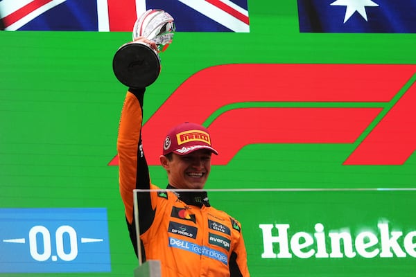 McLaren driver Lando Norris of Britain celebrates second place on the podium after the Chinese Formula One Grand Prix race at the Shanghai International Circuit, Shanghai, Sunday, March 23, 2025. (AP Photo/Andy Wong)