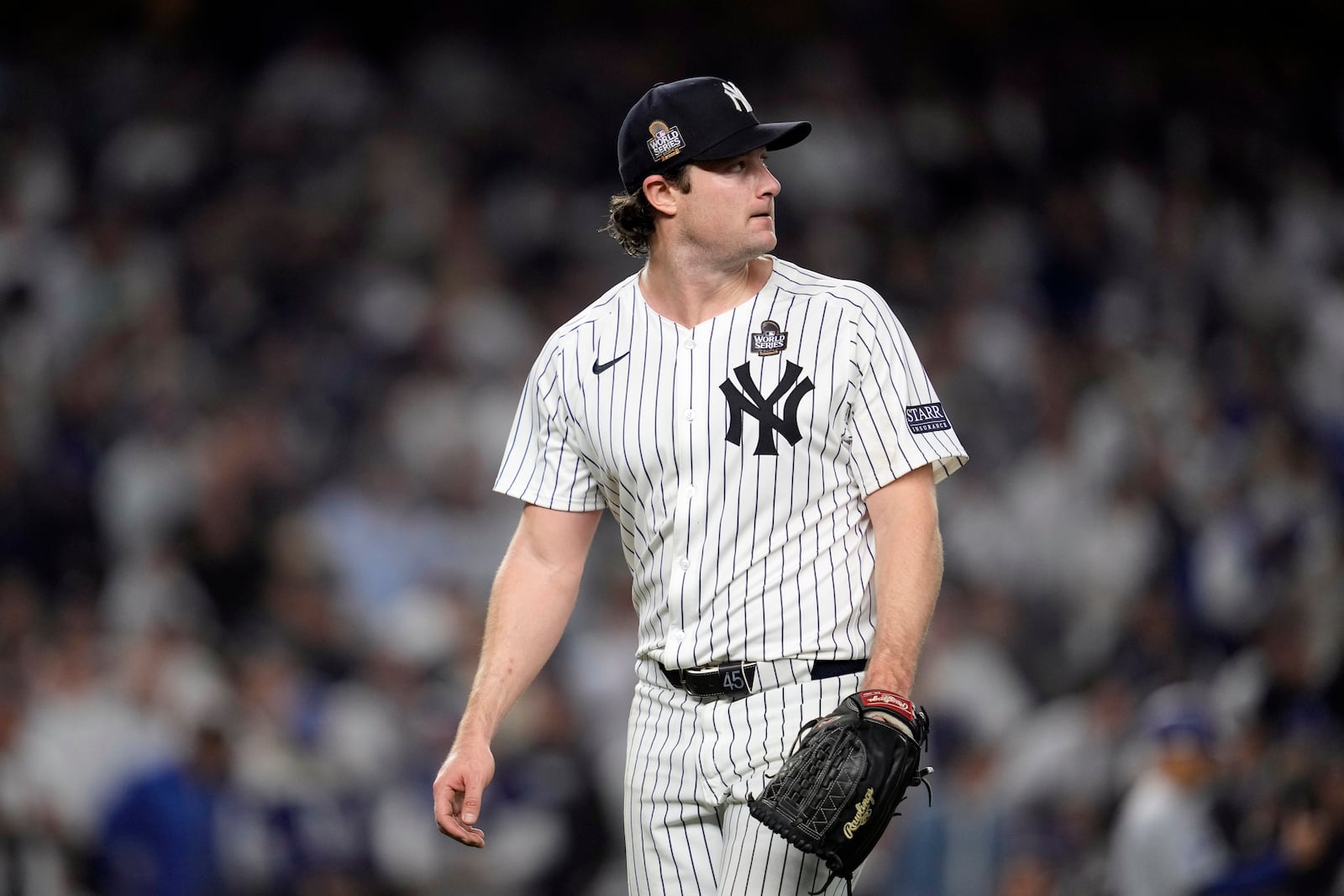 New York Yankees starting pitcher Gerrit Cole looks back toward the scoreboard after throwing against the Los Angeles Dodgers during the fifth inning in Game 5 of the baseball World Series, Wednesday, Oct. 30, 2024, in New York. (AP Photo/Godofredo A. Vásquez)