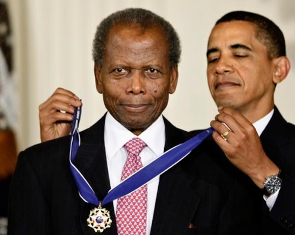 Sidney Poitier receives the 2009 Presidential Medal of Freedom from President Barack Obama at the White House in Washington, D.C. Poitier was the first African American to win an Academy Award for Best Actor.