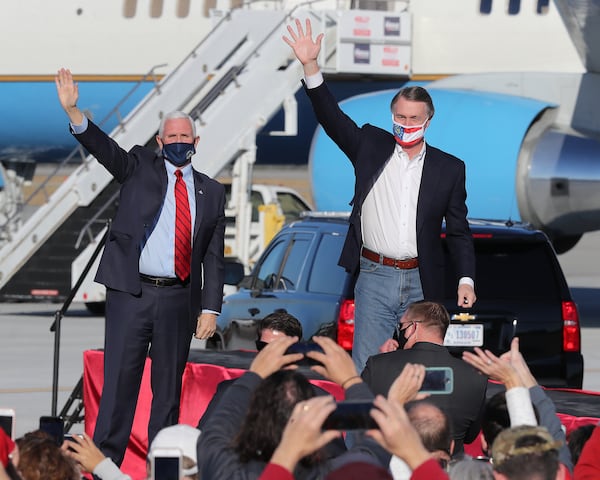 Former U.S. Sen. David Perdue, shown campaigning last year with then-Vice President Mike Pence, said Brian Kemp is already employing the same strategies Democrats used against Perdue in last year's U.S. Senate race. “He’s attacking me with all the lies the Democrats used," Perdue said. "That’s what politicians do. How can you trust someone like that?" (Curtis Compton/Atlanta Journal-Constitution/TNS)