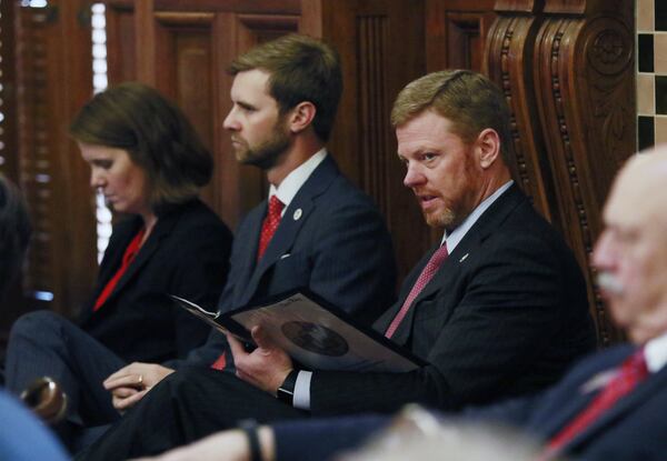 In this 2017 file photo, Gov. Deal’s Chief of Staff, Chris Riley, follows along with Deal’s speech. BOB ANDRES /BANDRES@AJC.COM