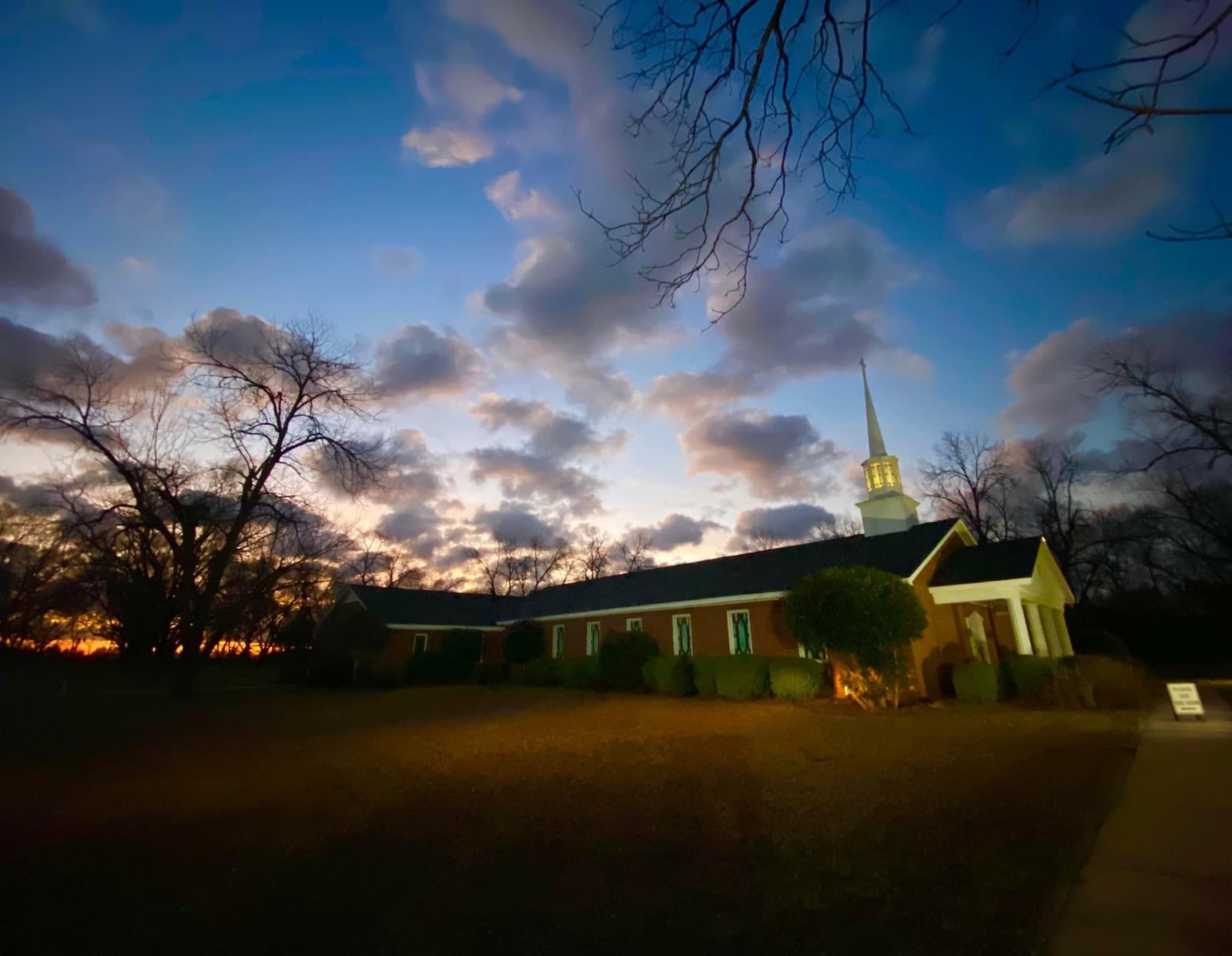 The sun rises over Maranatha Baptist Church as congregants prepare to say goodbye to former President Jimmy Carter. Photo: Richard Elliott/WSB