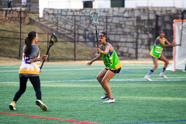 Pauline Caldwell (middle) plays defense during the Spelman College lacrosse game on Sunday, October 23, 2022, at Hammond Park in Sandy Springs, Georgia. Several girls on the Spelman team said that joining the lacrosse team was the first time they felt a part of something on campus. CHRISTINA MATACOTTA FOR THE ATLANTA JOURNAL-CONSTITUTION.