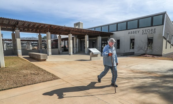 Robert Farrar frequently walks the Monastery grounds seen here near the Abbey Store on Thursday, Jan 13, 2022. (John Spink / John.Spink@ajc.com)

