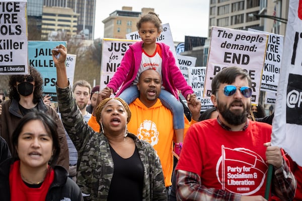 A crowd marched in downtown Atlanta on Jan. 28, 2023, to protest the killing of Tyre Nichols, who died after been attacked by five by Memphis police. The officers were fired and charged with murder, aggravated assault, aggravated kidnapping, official misconduct and official oppression. (Arvin Temkar/The Atlanta Journal-Constitution)