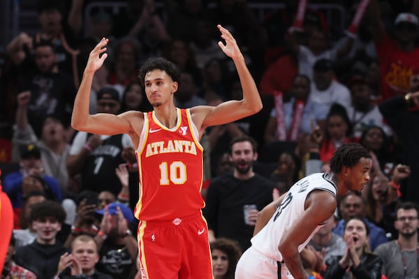 Atlanta Hawks forward Zaccharie Risacher (10) celebrates a dunk during the second half against the Brooklyn Nets at State Farm Arena, Wednesday, October 23, 2024, in Atlanta. (Jason Getz / AJC)

