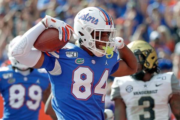 Florida tight end Kyle Pitts (84) celebrates after scoring a touchdown on a 15-yard pass reception during the second half of an NCAA college football game against Vanderbilt, in Gainesville, Fla. (AP Photo/John Raoux, File)