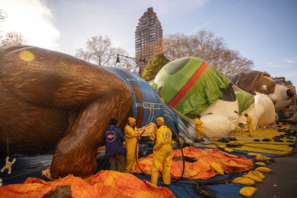 People inflate floats in preparation for the Macy's Thanksgiving Day Parade, Wednesday, Nov. 27, 2024, in New York. (AP Photo/Yuki Iwamura)