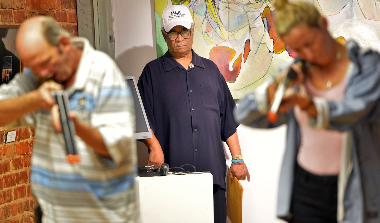 Former state Rep. Tyrone Brooks (background) watches the rehearsal of Moore’s Ford Lynching Re-enactment in 2013 at Fuse Arts Center in Atlanta. HYOSUB SHIN / HSHIN@AJC.COM