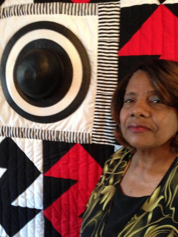 Marlene Bennett Jones of Fairburn shows off a quilt she made using one of her mother’s favorite church hats. After her mother was diagnosed with Alzheimer’s disease, Jones said the two of them found healing in quilting, a hobby her mother enjoyed in Gee’s Bend, Ala. GRACIE BONDS STAPLES / GSTAPLES@AJC.COM