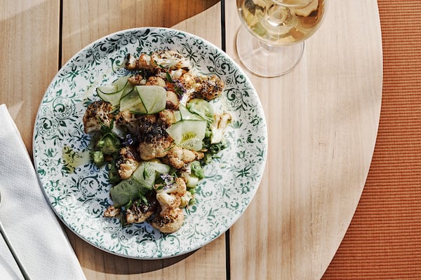 Charred cauliflower and cucumber is among the plant-forward, shareable plates on the menu at the Willow Bar at the Kimpton Sylvan Hotel in Buckhead. Courtesy of Andrew Thomas Lee