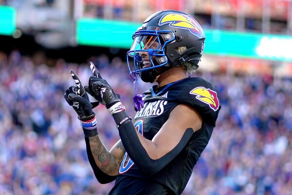 Kansas wide receiver Quentin Skinner celebrates after scoring a touchdown during the first half of an NCAA college football game against Iowa State Saturday, Nov. 9, 2024, in Kansas City, Mo. (AP Photo/Charlie Riedel)