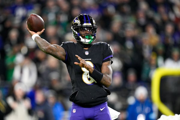 Baltimore Ravens quarterback Lamar Jackson throws a pass against the Philadelphia Eagles during the first half of an NFL football game, Sunday, Dec. 1, 2024, in Baltimore. (AP Photo/Nick Wass)