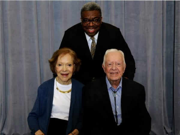 AJC journalist Ernie Suggs in 2019, with former President Jimmy Carter and first lady Rosalynn Carter.