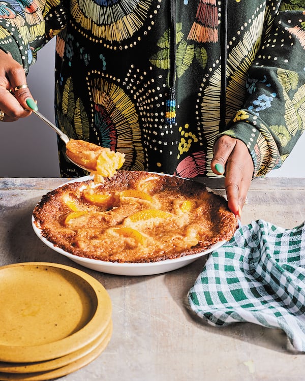 A baker friend helped actress and vegan food star Tabitha Brown convert a traditional dessert favorite into this recipe for Lazy Peach Cobbler to fit her plant-based diet. Photo by Matt Armendariz. From “Cooking From the Spirit: Easy, Delicious, and Joyful Plant-Based Inspirations” by Tabitha Brown (Morrow, $30). Reprinted by permission of William Morrow, an imprint of HarperCollins Publishers.