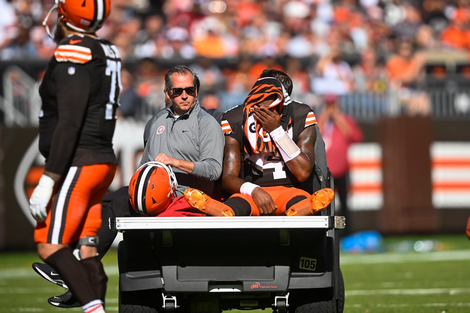 Cleveland Browns quarterback Deshaun Watson (4) is carted off the field after being injured in the first half of an NFL football game against the Cincinnati Bengals, Sunday, Oct. 20, 2024, in Cleveland. (AP Photo/David Richard)