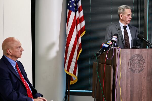 Former Gwinnett District Attorney Danny Porter (right) and Prosecuting Attorneys’ Council of Georgia Executive Director Pete Skandalakis speak during a news conference Tuesday.