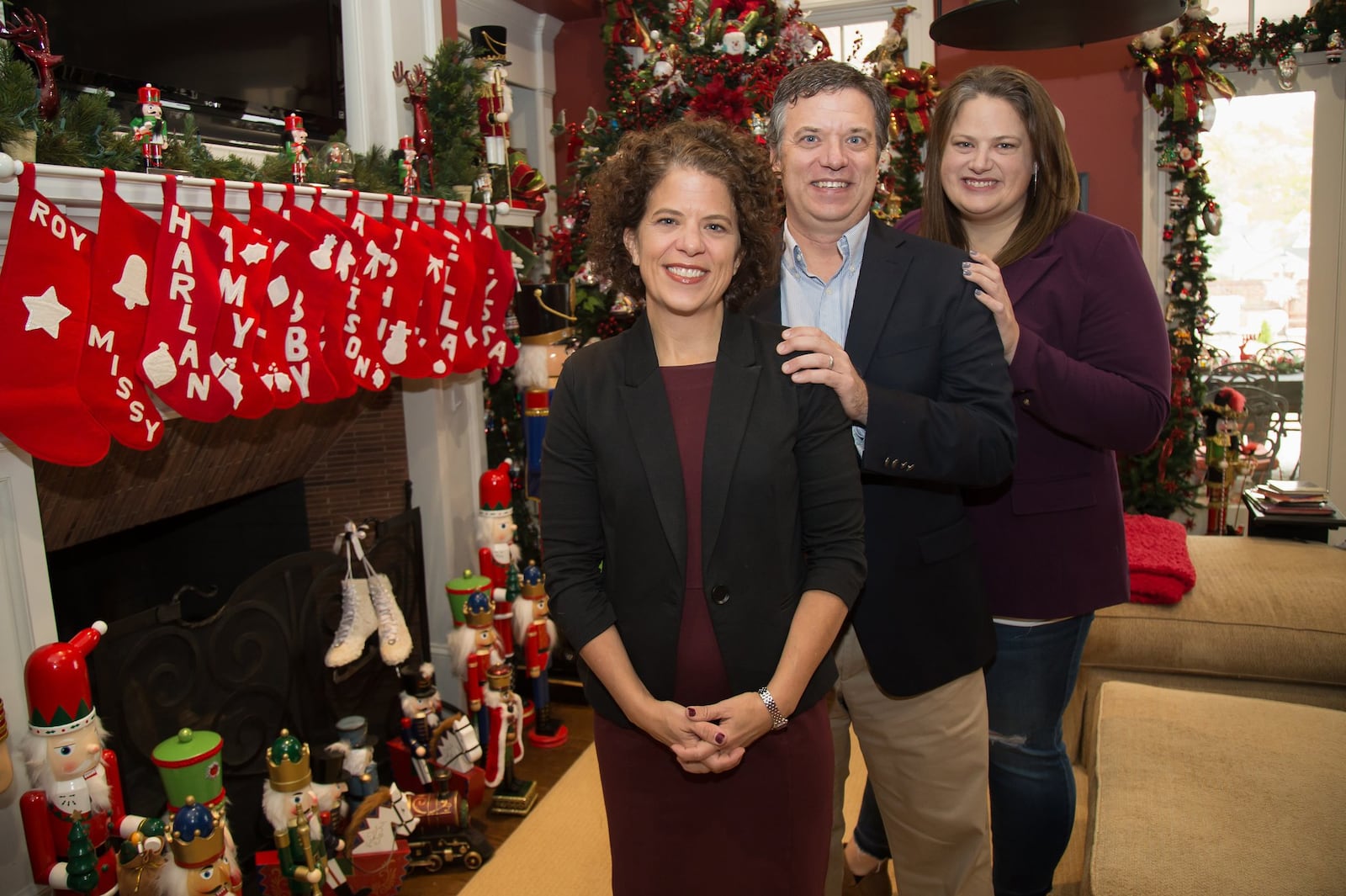 Judge Allison Barnes Salter (L) poses for a photograph with her siblings Harlan Barnes (C) and Alyssa Barnes (R) in their parents’ home in Marietta Friday, November 30, 2018. STEVE SCHAEFER / SPECIAL TO THE AJC