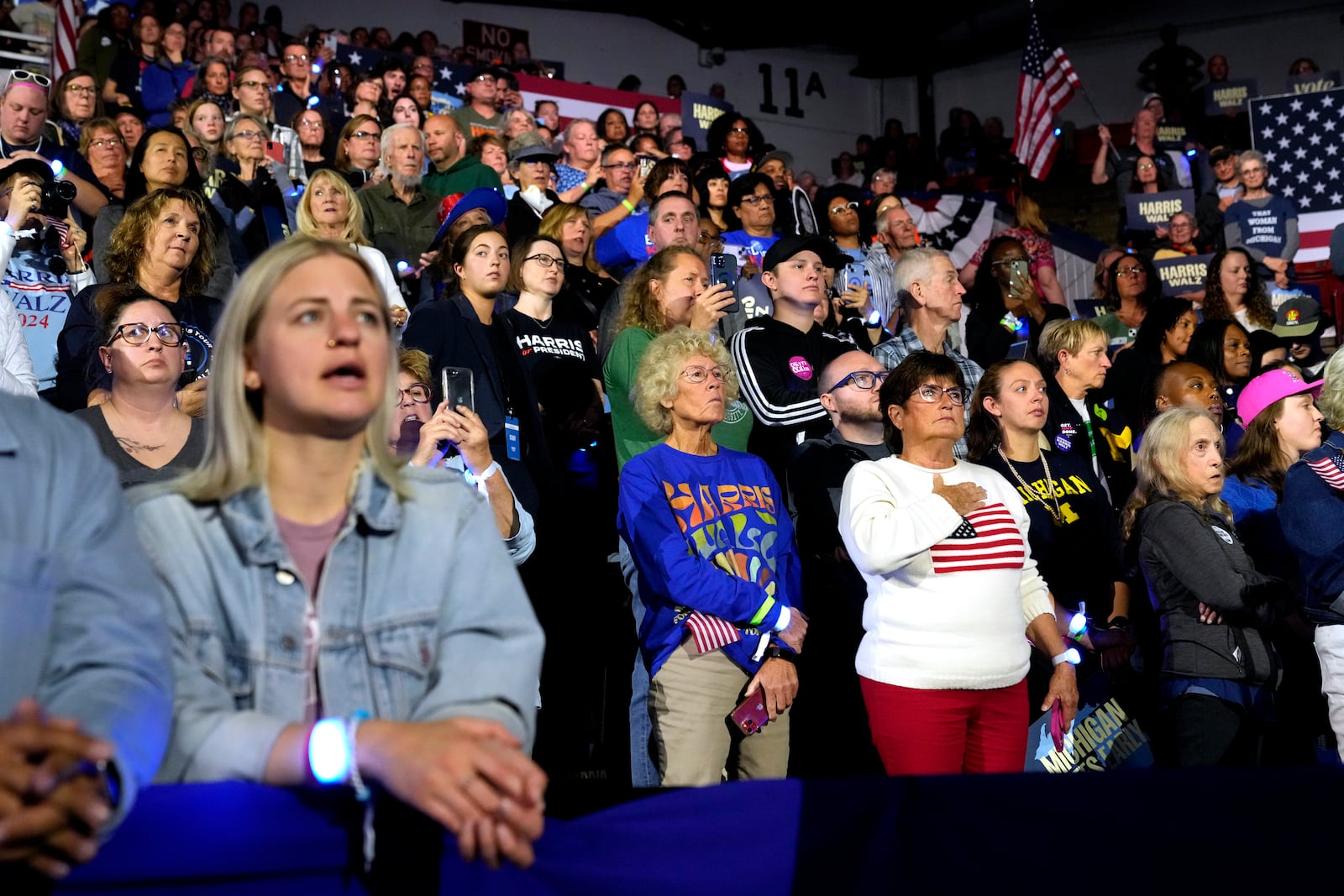 Supporters listen as former first lady Michelle Obama speaks at a campaign rally for democratic presidential nominee Vice President Kamala Harris at the Wings Event Center, in Kalamazoo, Mich., Saturday, Oct. 26, 2024.(AP Photo/Jacquelyn Martin)