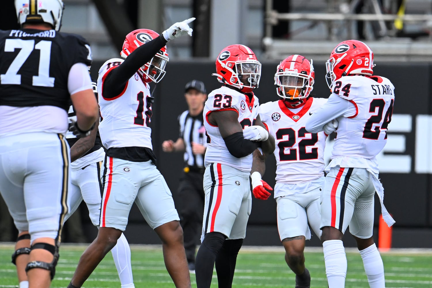 Georgia linebacker Jamon Dumas-Johnson, left, clebrates an interception by defensive back Javon Bullard (22) during the second half of an NCAA football game against Vanderbilt, Saturday, Oct. 14, 2023, in Nashville, Tenn. (Special to the AJC/John Amis)