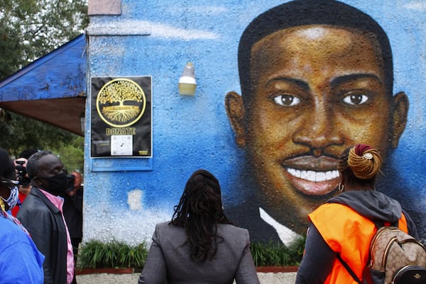 Demonstrators marched to a mural of Ahmaud Arbery painted on Brunswick's African American Cultural Center.