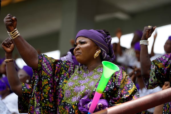 A woman attends the International Women's Day celebration at the Mobolaji Johnson Stadium in Lagos, Nigeria, Friday, March. 7, 2025. (AP Photo/Sunday Alamba)