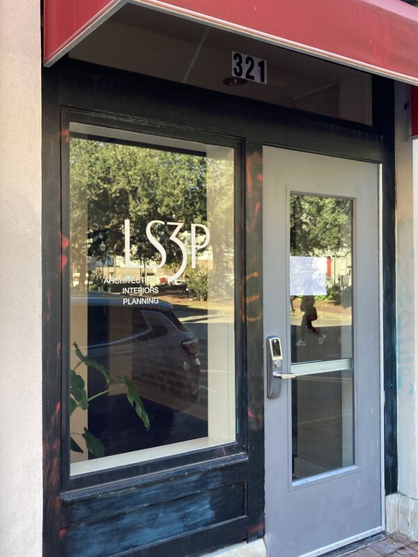 The storefront of LS3P architects in Savannah. Protestors defaced the entryway Thursday night with graffiti following a demonstration against the Atlanta Public Safety Training Center (Adam Van Brimmer/adam.vanbrimmer@ajc.com)