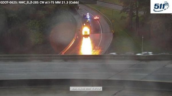 A traffic camera shows a HERO truck blocking the exit ramp from I-285 West to I-75 North.