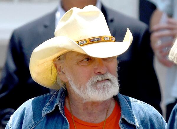 Dickey Betts, a founding member of the Allman Brothers Band, exits the funeral of Gregg Allman at Snow's Memorial Chapel, June 3, 2017, in Macon, Ga. Guitar legend Betts, who co-founded the Allman Brothers Band and wrote their biggest hit, “Ramblin’ Man,” died Thursday, April 18, 2024. He was 80. (Jason Vorhees/The Macon Telegraph via AP, File)