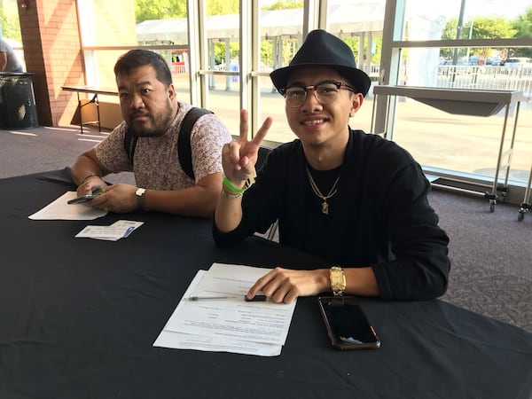 Chirmain Yang (right) with his uncle Darrell Yang at Infinite Energy September 20, 2018. CREDIT: Rodney Ho/rho@ajc.com