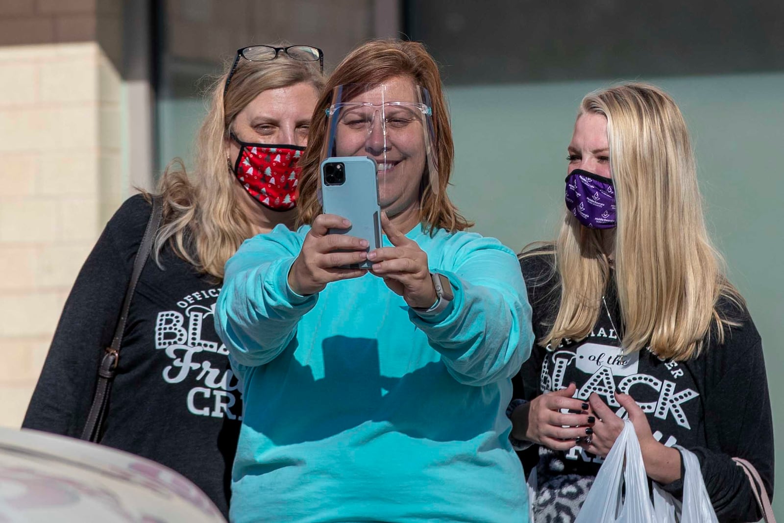 Lisa Hembree takes a selfie with her sister Krista Ellington (left) and niece Camryn Fields at the Fayette Pavilion on Friday.