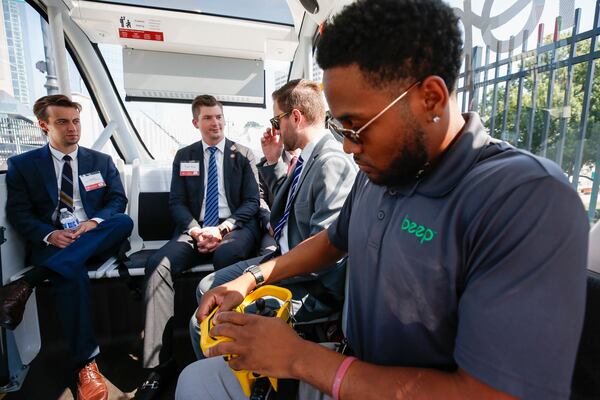 Drake Murray shows the controls of the autonomous shuttle at the unveiling of the Cumberland Hopper in Atlanta on Tuesday, July 25, 2023. (Katelyn Myrick/katelyn.myrick@ajc.com)