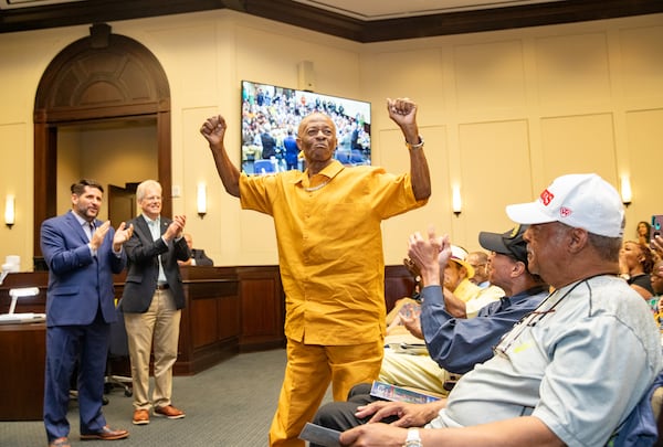 The Bailey-Johnson High School's basketball team of 1964-65, including Jimmy Taylor, is acknowledged and presented with his State Championship ring on Monday, July 17, 2023 at Alpharetta City Hall during a city council meeting.  (Jenni Girtman for The Atlanta Journal-Constitution)