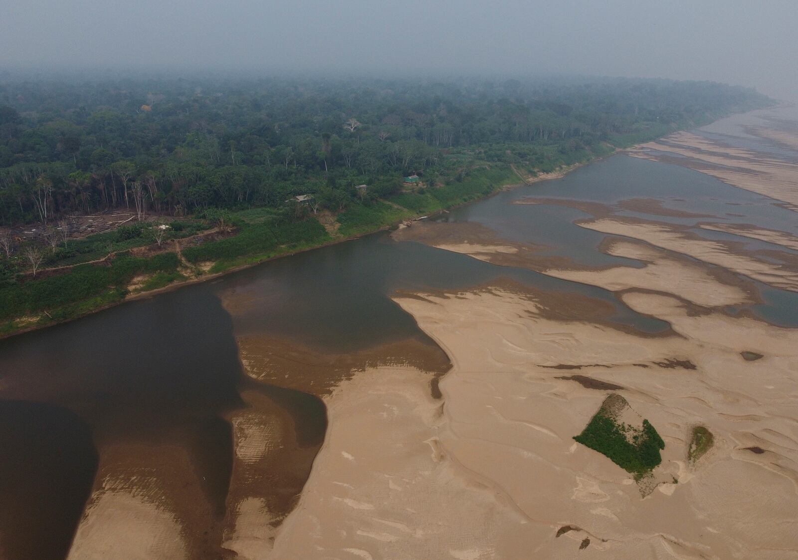 An aerial view shows the Madeira River, a tributary of the Amazon River, during dry season in Humaita, Amazonas state, Brazil, Saturday, Sept. 7, 2024. (AP Photo/Edmar Barros)