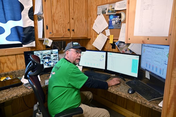 Mark Rodgers shows how each of the farms hundreds of cows are individually monitored 24 hours a day. Artificial intelligence can tip the Rodgers family off to health, from sickness to when a cow is ready to breed. (Hyosub Shin / Hyosub.Shin@ajc.com)