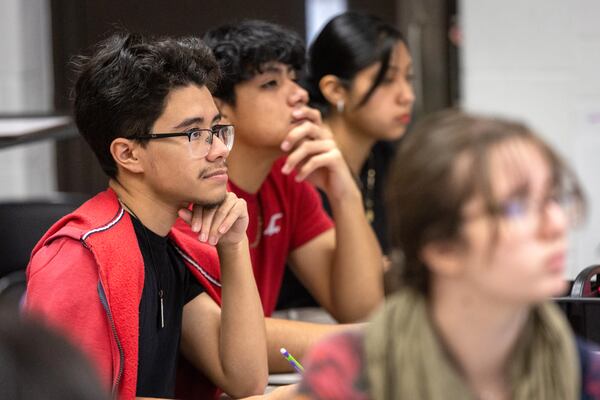 Lakeside High School seniors work through equations in Taylor Ohlstrom's college algebra course Tuesday, Jan. 31, 2022.  (Steve Schaefer/steve.schaefer@ajc.com)