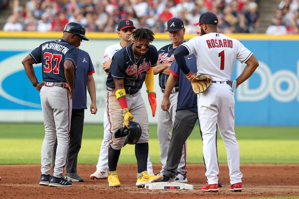 Braves right fielder Ronald Acuna Jr. (13) is examined after being shaken up stealing second base during the third inning of the Major League Baseball Interleague game between the Atlanta Braves and Cleveland Guardians on July 3, 2023, at Progressive Field in Cleveland, OH. (Photo by Frank Jansky/Icon Sportswire) (Icon Sportswire via AP Images)