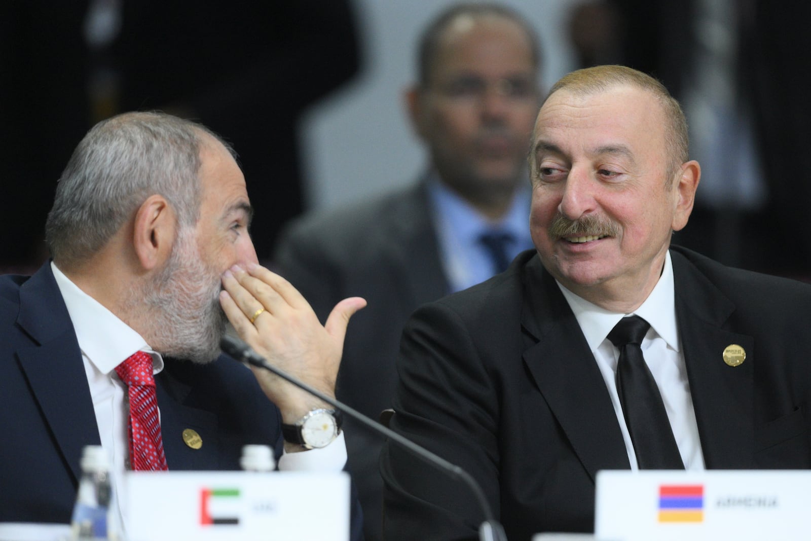 Armenian Prime Minister Nikol Pashinyan, left, and Azerbaijani President Ilham Aliyev attend Outreach/BRICS Plus format session on the sidelines of the BRICS summit in Kazan, Russia, Thursday, Oct. 24, 2024. (Ramil Sitdikov/Photo host brics-russia2024.ru via AP)