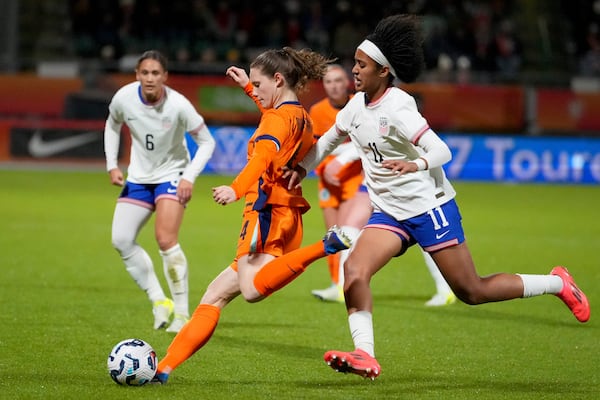 United States' Lily Yohannes, right, vies for the ball with Netherlands' Veerle Buurman during the international friendly women's soccer match between the Netherlands and the United States at the ADO Den Haag Stadium in The Hague, Netherlands, Tuesday, Dec. 3, 2024. (AP Photo/Peter Dejong)