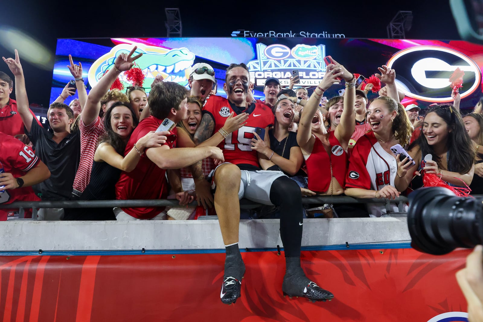 Georgia quarterback Carson Beck celebrates with fans after Saturday's win over the Florida Gators in Jacksonville.
