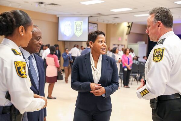 Ramos (center) introduces herself to members of DeKalb County's law enforcement before a press conference Monday. (Alyssa Pointer/Atlanta Journal Constitution)