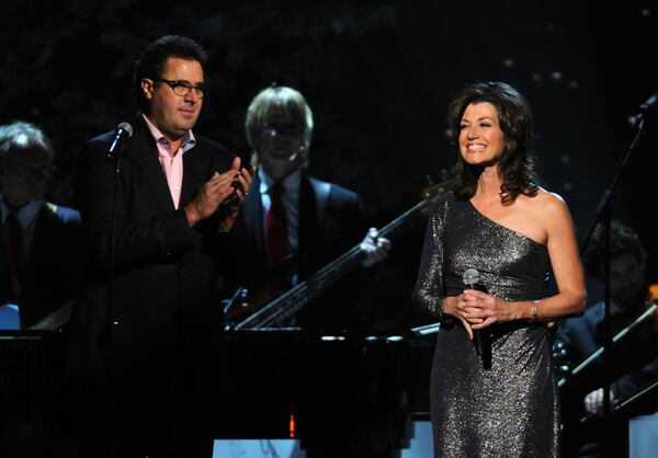 NASHVILLE, TN - NOVEMBER 10: Vince Gill and Amy Grant perform at the 2011 Country Christmas at the Bridgestone Arena on November 10, 2011 in Nashville, Tennessee. (Photo by Rick Diamond/Getty Images) Amy Grant is going to be heard quite a bit on the Fish over the next month singing Christmas tunes. CREDIT: Getty Images