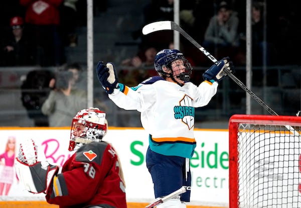 New York Sirens' Sarah Fillier (10) celebrates scoring on Ottawa Charge goaltender Emerance Maschmeyer (38) during the second period of a PWHL hockey game in Ottawa, on Wednesday, Feb. 26, 2025. (Justin Tang/The Canadian Press via AP)